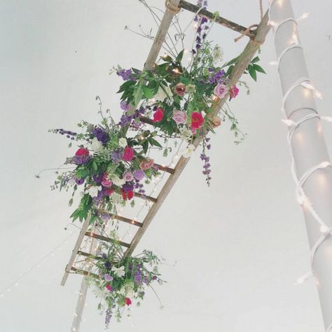 Suspended florals on ladder - Our Favorite Instagram Posts 6.17.16 | WeddingDay Magazine Hanging Ladder With Flowers, Hanging Ladder Flowers Wedding, Flower Ladder, Wildflower Hanging Garland, Ladder Floral Installation, Ladder Wedding, Boho Hanging Floral Installation, Hanging Ladder, Ladder Display