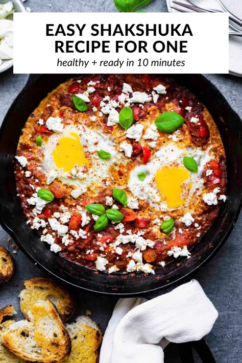 Shakshuka for One, or poached eggs in tomato sauce, is a hearty and saucy breakfast or brunch that's packed with flavor! It's quick and easy to make, and ready in just 20 minutes! You can make it with either fresh or canned tomatoes, so you can enjoy this North African dish all year round! Shakshuka With Feta, Easy Shakshuka Recipe, Tomatoes Eggs, Vegetarian Breakfast Ideas, Best Healthy Breakfast, Toasted Baguette, Shakshuka Recipes, Feta Recipes, Iron Skillet Recipes