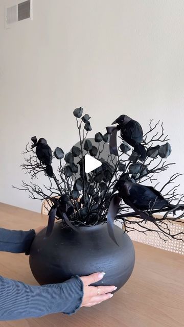 Deborah Trette on Instagram: "easy and spooky! — I got my vase from @homegoods and added stems and mini crows with bows 🖤

perfect halloween centerpiece! comment SHOP for a 🔗 straight to your inbox! https://liketk.it/4RdEF

#diy #diyhomedecor #diyhalloween #halloweendecor #halloweenidea #halloween #falldecor #easyproject #ltkhome #ltkvideo #ltkseasonal" Halloween Vase, Halloween Centerpiece, Crows, Easy Projects, Halloween Diy, I Got This, Fall Decor, Halloween Decorations, Home Goods