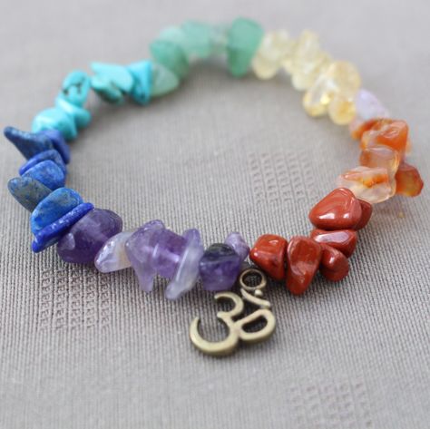 Tibetan Inspired Crystal Chakra Bracelets. Each Chakra bracelet has the following Crystals: Crown - Violet - Amethyst Brow - Indigo - Lapis Lazuli Throat - Blue - Turquoise Heart - Green - Aventurine Solar Plexus - Yellow - Citrine Sacral - Orange - Carnelian Root - Red - Red Jasper This lovely Crystal Chakra bracelet is made from pretty, natural tumbled crystal chips threaded on elasticated cord and comes with it's own Organza bag. Also a Chakra information card and an OM Charm. Chakra Information, Crystals Crown, Mala Jewelry, Om Charm, Crystal Chakra, Orange Carnelian, Citrine Bracelet, Crystal Chips, Antique Jewelry Indian