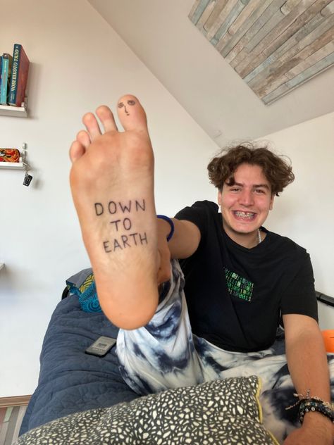 Down to earth ; foot tattoo ; feet tattoo ; Saitama tattoo ; cool tattoos ; art ; art tattoos Down To Earth Tattoo, Earth Angel Tattoo, Come Back To Earth Tattoo, Tooth Tattoo, Earth Tattoo, Cool Tattoos For Guys, Angel Tattoo, Foot Tattoo, Foot Tattoos