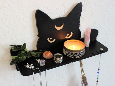 "Celestial cat altar shelf is crafted with slots to hold pendulums or necklaces and have enought space to place personal magic things. Use it as a pendulum / necklace / jewelry holder or crystal shelf or plant shelf or display shelf wall -  an eye-catching peeking cat moon design helps save the place in a small room space and definytely attracts attention. Great witchy friend gift idea - as a birthday gift, housewarming gift - especially for the modern wicca home decor.                -- * 🌙 * Pet Altar Ideas, Pendulum Holder, Cat Related Gifts, Altar Shelf, Customized Furniture, Style Shelves, Magic Things, Crystal Shelf, Pendulum Necklace