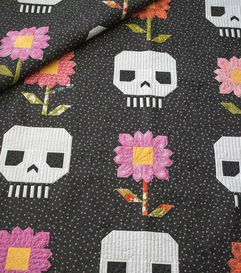 Be the talk of the graveyard with this hauntingly sweet skull-and-flower quilt pattern. This design is perfect for Halloween, Dia de los Muertos, or any time you crave a bit of spooky patchwork. It’s sure to make a lasting impression with its eye-catching design and irresistible charm. This is a quilt that is truly “to die for.” Finished Block: 16” x 16” Finished Quilt: 80-1/2” x 80-1/2” Skill Level: Intermediate #quiltersgonnaquilt #sewersgonnasew#igquiltingcommunity #quiltsofinstagram #... Modern Boy Quilt, Pushing Up Daisies, Skull Quilt, Quilt Binding Tutorial, Flower Quilt Patterns, Charm Pack Quilt, Sunflower Quilts, Jelly Roll Quilt Patterns, Skull Flower