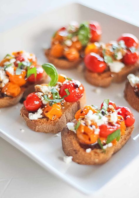 Cherry Tomato Confit Crostini is one of the best easy appetizers for any occasion! These little bites of mini bruschetta are full of flavor from the juicy tomatoes, tart goat cheese, sweet balsamic and fresh basil. They are easy to make and always a crowd pleaser! #finishedwithsalt #confit #tomatoes #appetizer #gameday #partyfood | finishedwithsalt.com Tomato Crostini, Tomato Goat Cheese, Fancy Toast, Cheese Crostini, Goat Cheese Crostini, Crostini Appetizers, Crostini Recipes, Bon Apetit, Potluck Party