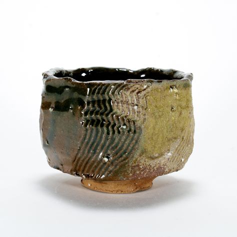 Rustic Green Stoneware Chawan with Feldspar Inclusions Cone 6 Oxidation 4.25" x 4.25" x 3.5" This chawan was handbuilt using the kurinuki method of carving objects out of a solid piece of clay.  This handcrafted stoneware tea bowl is made of iron bearing clay, and is fired up to Cone 6 (about 2220F, 1220C) in electric oxidation. This clay is completely vitrified at this temperature an can safely be microwaved and washed in the dishwasher. Due to the handcrafted nature of this object, minor variations in size, shape, and surface decoration will occur. Chawan Tea Bowl, Surface Decoration, Tea Bowl, Ceramics Pottery Art, Matcha Tea, Pottery Pieces, Japanese Tea, Tea Bowls, Ceramic Cups