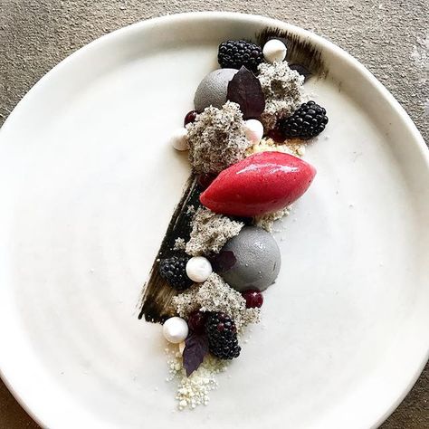 Mokutan: black sesame white chocolate mousse, black sesame chiffon, cherry sorbet, cherry gel, white chocolate soil, blackberry, @hausbarfarmsatx purple basil, meringues. #uchi #uchiaustin #dessert #pastry #atxfood #blacksesame #chiffon #sweets #haihospitality #pastrychef #cacaobarry #cacaobarryzephyr . Cherry Sorbet, Chocolate Soil, Black Forest Cheesecake, Fine Dining Desserts, Raspberry Coconut, White Chocolate Mousse, Dessert Plating, Fine Dining Recipes, Fancy Desserts