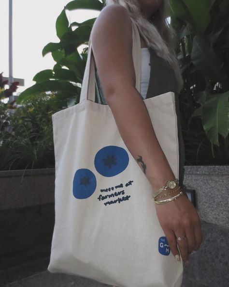 🌿 Exciting News! 🌿 We’re thrilled to announce the launch of our “Meet Me at the Farmers Market” Blueberry Tote! 🍇✨ Continue with your favorite design and elevate your market trips with this fresh, stylish, and eco-friendly bag. Perfect for carrying all your organic goodies! 🥕🥬 grab yours now! 🌟 #FarmersMarket #EcoFriendly #BlueberryTote #SustainableStyle #MarketVibes #HandmadeToteBags, #SustainableFashion, #EcoFriendlyTotes, #HandDrawnDesigns, #ArtisanToteBags, #EthicalFashion, #ReusableSh... Painted Tote, Fall 24, Eco Friendly Bags, Handmade Tote, Summer Crafts, Exciting News, Goodie Bags, Ethical Fashion, Farmers Market