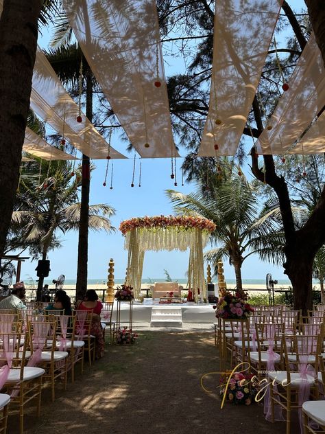 Indian Wedding Ceremony at Beleza By The Beach, Goa. This circular mandap is adorned with different flowers that give it a beautiful and unique look! The seating area is covered by drapes with hanging flowers that look mesmerizing in the afternoon wind.‎ ‎‎ ‎ ‎ ‎ ‎ ‎ ‎ ‎ ‎ ‎ ‎ ‎ ‎ Indian Wedding Decor | Wedding Mandap | Mandap Decor | Outdoor Wedding | Wedding Decor Ideas | Destination Wedding Outdoor Wedding Decorations Indian, Indian Beach Wedding, Beach Wedding Setup, Wedding Decorations Indian, Indian Wedding Venue, Indian Wedding Theme, Indian Destination Wedding, Goa Wedding, Indian Wedding Decor