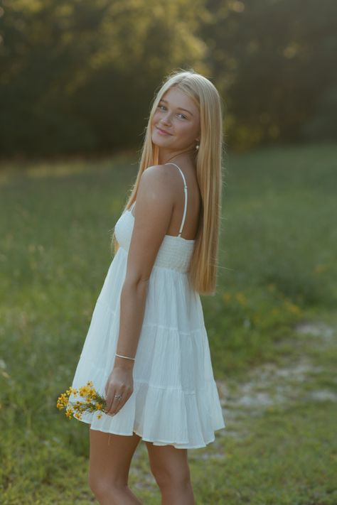 White Dress Flowers Sunny Field Senior Outfit Inspo Golden Hour North GA Photographer Senior Pic Inspo Sundress Senior Pictures, Short Dress Senior Pictures, Senior Photo White Dress, Short White Dress Senior Pictures, White Dress For Senior Pictures, White Dress Senior Pics, Summer Senior Pictures Outfits Dresses, Senior Picture White Dress, Senior Picture Ideas White Dress