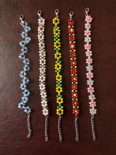 Colorful Seed Bead Bracelet Dainty Beaded Flowers Bracelets Tiny colorful seed beads make up this delicate flower bracelet. Great for layering with other bracelets Choose your length for the perfect fit. Includes a lobster clasp and 1.5 inch extension chain.  *Some colors may be fade over time after being exposed to water. Comes in various different sizes or just order your favorite color and size and we will make it especially for you. Add to that our asortments of beautiful array of colored beaded barefoot sandals excellent for the beach. Anklets, necklace, and bracelets, that skillfully made with love.  Buy as singles or as a set.  Used as a sentiment for your love ones, him and hers bracelets, personalized names, zodiac signs. Great for any gifts ideas. Islandgirls Summer Sassy jewelry Cute Tiny Bead Bracelet Ideas, Bracelets Ideas For Summer, Anklet Seed Bead, Beaded Bracelets Seed Beads, Seed Bead Creations, Seed Bead Bracelet Sets, Seed Bead Bracelets Flower, Simple Seed Bead Bracelets, Things To Make With Seed Beads