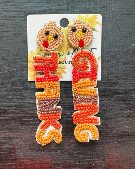 🦃✨ Gobble up the cuteness with these beaded turkey earrings, perfect for adding a festive touch to your Thanksgiving outfit! 🎃🍂 From adorable pumpkins to “Thanks” & “Giving” details, these handcrafted beauties are giving all the fall vibes. 🍁 Limited stock – grab yours at Sunflowers & Cotton T’s Boutique and let your accessories do the talking this season! 🧡💛 #ThanksgivingStyle #TurkeyEarrings #FallAccessories #sunflowersandcottontsboutique #HolidayFashion #HandmadeJewelry #beadedearrings #ea... Turkey Earrings, Thanks And Giving, Thanksgiving Earrings, Thanksgiving Fashion, Turkey Thanksgiving, Turkey Design, Thanksgiving Celebration, Thanks Giving, October 29