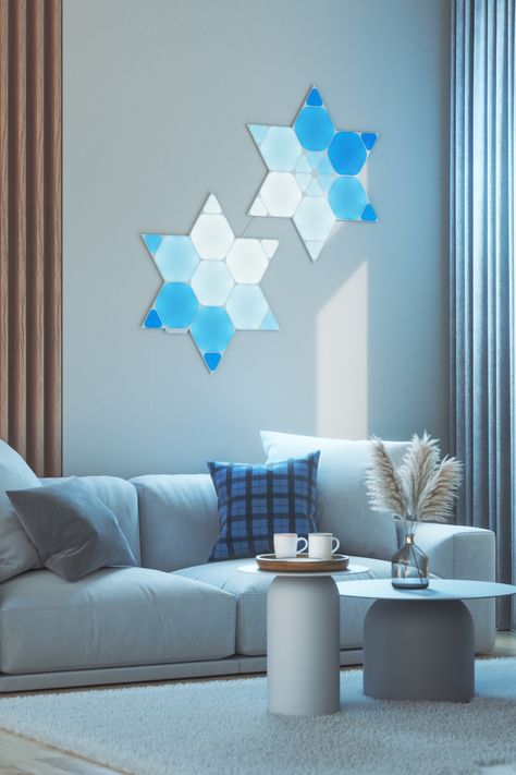 Nanoleaf Shapes mounted on the wall in a living room behind the couch Nanoleaf Living Room, Nanoleaf Mini Triangle Ideas, Nanoleaf Shapes Design, Nanoleaf Triangle Ideas, Nanoleaf Hexagon Designs, Nanoleaf Design Ideas Hexagon, Nano Leaf Lights Design, Nanoleaf Hexagon, Nanoleaf Design Ideas