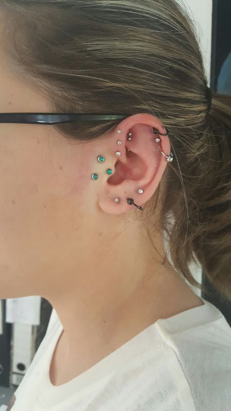 Multiple piercings, opal surface tragus Surface Tragus And Tragus Piercing, Double Surface Tragus Piercing, Double Anti Tragus Piercing, Triple Tragus Piercing, Surface Tragus Piercing Jewelry, Sideburn Piercing, Tragus Tattoo, Surface Tragus Piercing, Double Tragus Piercing