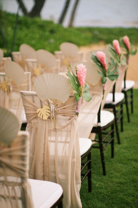 neutral fabric, wooden palm leaves and bold flowers Bridal Lehenga Simple, Samoan Wedding, Lehenga Simple, Coastal Weddings, Flower Chair, Wedding Ceremony Chairs, Barbados Wedding, Maui Destination Wedding, Tropical Wedding Theme