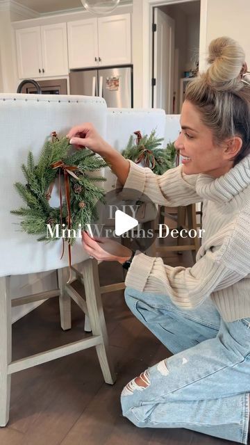 Alexandra Harper on Instagram: "🎄 Probably the easiest little DIY decor project! Can also be hung on cabinets, dining room chairs and etc.   I used long push pins since our chairs are linen but for anything else just use small command hooks!  ✨Comment WREATHS to shop or click my LTK shop in my bio   • • • #christmasdecorating #christmaswreaths #diyholidaydecor #diychristmasdecor #holidayinspo #holidaydecorations #targethome" Christmas Dining Room Chair Decor, Decorate Dining Chairs For Christmas, Christmas Wreath Dining Chairs, Christmas Wreaths On Chair Backs, Chair Christmas Decorations, Christmas Dining Chair Decor, Wreath On Chair Back, Small Wreaths On Cabinets, Cabinet Wreath Kitchen