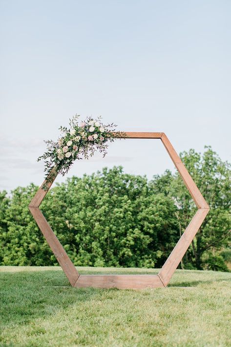 Hexagon wedding arch flowers