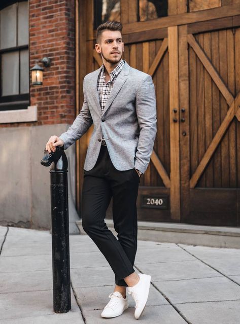 Modern and versatile: grey blazer, white and black dress shirt, black dress pants, and white sneakers. Ideal for business casual settings and social events. Formal Dressing Style For Man, Grey Blazer Black Pants, Grey Jacket Black Pants, Grey Blazer Outfit, Black Pants Outfit, Black Plaid Shirt, Grey Suit Jacket, Pants Outfit Men, Black Pants Men