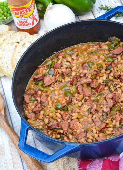 Southern hoppin john in a blue Dutch oven Hoppin John Recipe With Sausage, Southern Hoppin John Recipe, One Pot Jambalaya Recipe, Hoppin John Recipe, Peas And Rice, Hoppin John, Ringing In The New Year, Jambalaya Recipe, Southern Recipes Soul Food