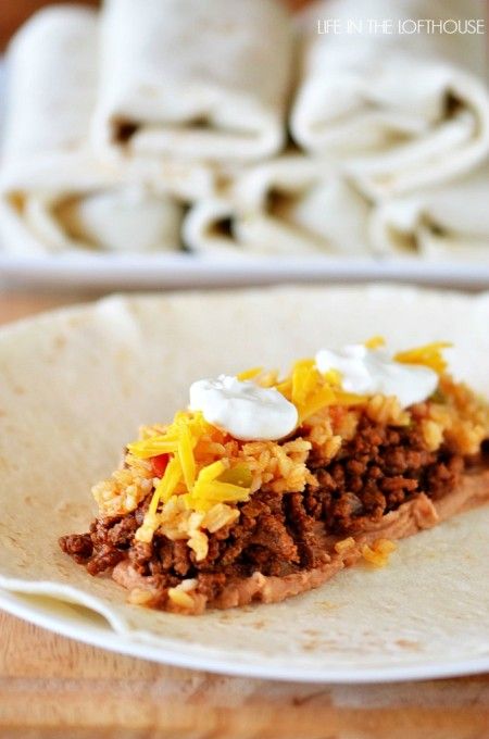 Freezer Beef and Bean Burritos a must try. refried beans, ground beef,rice, cheese and a dollop of sour cream. burrito size tortillas. freeze. good 2 months. Beef And Bean Burritos, Beef Burritos, Life In The Lofthouse, Freeze Ahead Meals, Bean Burritos, Make Ahead Freezer Meals, Work Meals, Menu Plan, Dinner Entrees