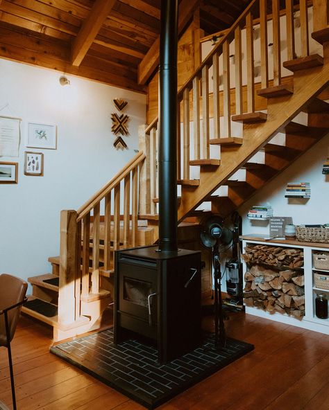 Fireplace By Stairs, Wood Stove Tile, Brick Fireplace Hearth, Cabin Staircase, Wood Burning Stove Corner, Cabin Homestead, Waiting For Fall, Staircase Fireplace, Hearth Pad