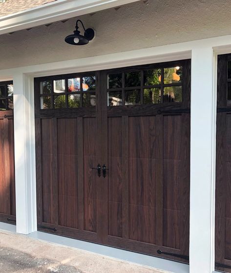 Achieve the sophisticated look of a wood carriage house garage door—without the added maintenance. Shown: Model 5602 in Walnut Accents Woodtones with Stockton windows and Wrought Iron hardware. Chi Garage Doors, Custom Wood Garage Doors, Carriage Style Garage Doors, Carriage House Garage Doors, Single Garage Door, Carriage House Doors, Garage Door Panels, Garage Door Windows, Wooden Garage Doors