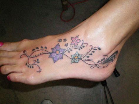 Foot tattoo:) I love the placement of this one not as much of a fan of this type of flower would need to be a daisy for me. Henna Tattoo Foot, Butterfly Ankle Tattoos, Unique Tattoos For Women, Ankle Tat, A Tattoo Design, Remembrance Tattoos, Hand And Finger Tattoos, Ankle Tattoos, Foot Tattoos For Women