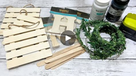 Farmhouse Home Sign DIY | Have you seen these cute hanging pallets from Dollar Tree? I was so excited to see them! They were perfect for this diy! I think it came out so pretty! | By We Craft Around | Hi, everyone. It's Beth and
today I'm making a Farmhouse Home Sign. I used three of
these little hanging pallets from Dollar Tree. These letters
from Hobby Lobby. They come two in a pack. I got H, M, and E.
This garland I got from Amazon. Some popsicle sticks. I ended
up needing four. White and black chalk paint and hot glue.
I started by removing the hangers from two of the
palettes and the staples. I left the hanger on the third
one. Next I painted all three
pallets with the white chalk paint. I did front and back.
And I did two coats. I also painted the four popsicle
sticks with the white Small Pallet Crafts Easy Diy, Diy Farmhouse Decor Dollar Tree, Dollar Tree Wooden Pallet Crafts, Dollar Tree Address Sign Diy, Dollar Tree Wooden Plaque Ideas, Dollar Store Pallet Crafts, Dollar Tree Wood Sign Crafts, Dollar Tree Sign Crafts, Dollar Tree Wood Plank Crafts