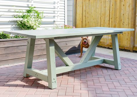 To see how we built our patio table, see part I here!Hey, pretty table! Paint looks good on you.After we shared how the DIY build went down, some of you wondered why we didn't consider staining the table. We both agree that this hunky style would be so pretty stained, but in our case, we… Patio Table Ideas, Outdoor Furniture Ideas Backyards, Wood Patio Table, Diy Patio Table, Round Patio Table, Yellow Brick Home, Diy Outdoor Table, Outdoor Remodel, Brick Home