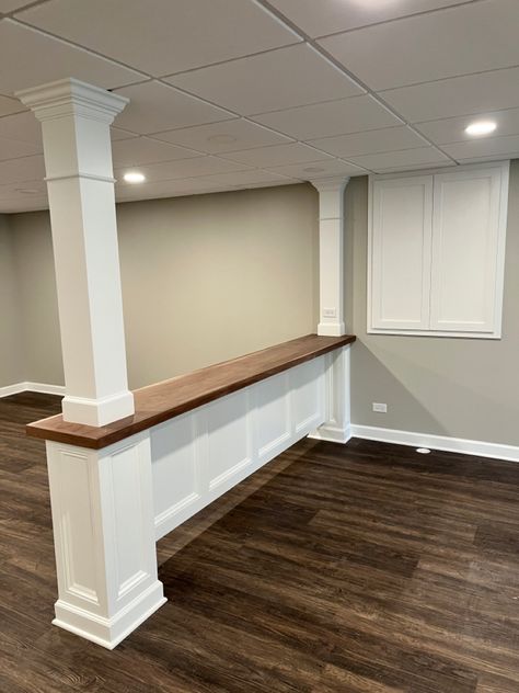 Basement Post Ideas Columns, Finished Basement With Support Poles, Basement Couch Bar, Table Around Basement Pole, Basement Bar With Support Post, Basement Ideas With Poles, Basement Bar Seating Behind Couch, Narrow Long Basement Ideas, Bar Wall Tv