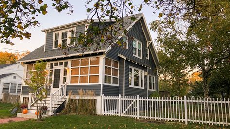 Portland Bungalow Portland Bungalow, Cape Cod Exterior, Maine Homes, Portland Street, Exposed Rafters, Brick Chimney, Green Facade, Grey Palette, Yellow Doors