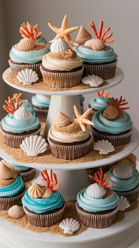 These Coastal-Inspired Beach-Themed Cupcakes bring a breath of fresh ocean air to your dessert table. The cupcakes are delicately decorated with blue frosting to mimic the gentle waves of the sea, while graham cracker crumbs create a sandy beach effect. Topped with candy seashells and edible starfish, these cupcakes capture the essence of a day at the beach. The light, moist cake is complemented by the rich, creamy frosting. Perfect for summer parties or beach weddings. Ocean Themed Dessert Table, Food For Beach Wedding, Ocean Dessert Table, Cupcake Beach Theme, Bday On The Beach, Ocean Macarons, Cute Beach Birthday Ideas, Sea Themed Cupcakes, Ocean Themed Desserts