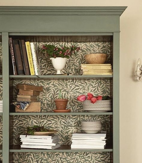 Old Bookshelves Makeover, Cottage Bookcase Ideas, Painted Bookshelf With Wallpaper, Book Shelf Paint Ideas Colour, Flipped Bookshelf, Bookcase Wallpaper Back, Painted Bookcase With Wallpaper, Wallpaper Shelves Bookshelves, Painted Bookshelves With Wallpaper