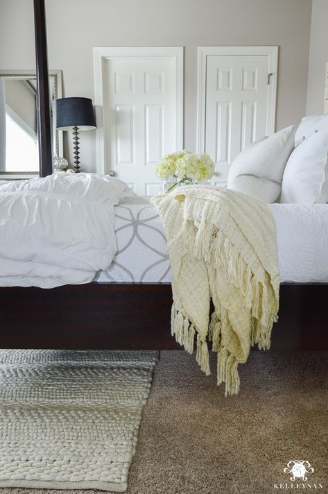 Why Rugs Should be Layered On Carpet Rug Over Brown Carpet Bedroom, Bedroom Rug Over Carpet, Bedroom Tan Carpet, Layered Carpets Bedroom, Rugs On Top Of Carpet, Guest Bedroom Rug, Nonslip Rugs On Hardwood Floirs, Rugs In Bedroom With Hardwood 6’7” X 9, Brown Carpet Bedroom