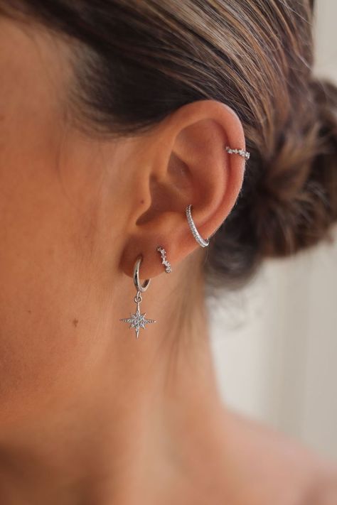 Create a gorgeous celestial inspired ear stack with Cartilage Cartel. Huggies, Hoops, Studs and Cuffs made with 925 Sterling Silver or 18 Carat Gold. #CELESTIALEARRINGS #CELESTIALJEWELERY #EARRINGS #EARSTACKING #CURATEDEARS #PIERCINGIDEAS Earrings Aesthetic Stacked, Earring Inspo Silver, Earrings Aesthetic Silver, Silver Earring Stack, Summer Jewlery, Silver Earrings Aesthetic, Wishlist Board, Ear Stacking, Indian Queen