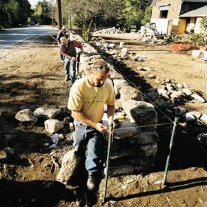 3 Ways to Reduce Road Noise in Your Backyard - This Old House Noise Barrier, Stone Fence, Sound Barrier, Privacy Landscaping, Busy Street, Backyard Remodel, This Old House, Stone Walls, Best Insulation