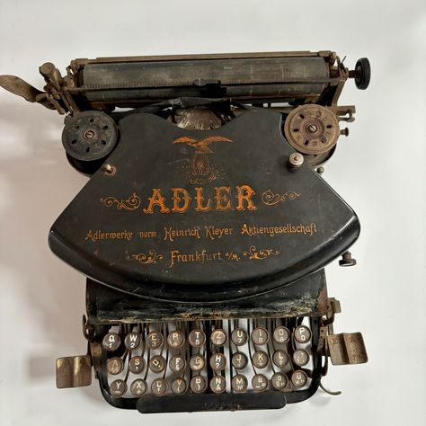 This typewriter was manufactured by Alder - the German company Adlerwerke vormals Heinrich Kleyer (Adler Works, formerly Heinrick Kleyer) of Frankfurt, Germany during the early 20th century.  The typewriter has a cast iron frame, nickel fittings. The machine is probably beyond repair, even though very well made the internal mechanisms are still there, yet it is very rusty and the keys do not work as they should. The packaging of the machine has many surface defects that are associated with the age of use, there is also a missing nut on the top layer or cover. This would be a great prop or accessory to an office or workplace, the type is nice and legible still so is visually a nice piece. The original ribbon wheels are there but need cleaning and replacing. Please see al photos Made of meta Antique Interior Design, Beginner Yoga Workout, Church Aesthetic, Frankfurt Germany, Vintage Typewriter, Herbal Magic, Antique Interior, Vintage Typewriters, Typewriter