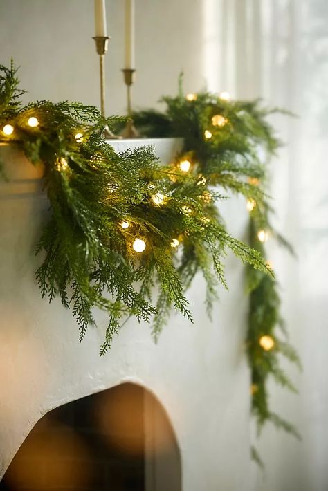 Holiday Décor, Ornaments, Gift Wrap & More | Anthropologie Traditional Farmhouse Christmas Decor, Christmas Wall Art Living Room, Farm Fresh Christmas Tree Decor, Classy Outside Christmas Decor, Christmas Holiday Party Decor, Mantle Decorated For Christmas, Christmas Decor Arched Doorway, Built Ins Christmas Decor, Christmas Wreath Lights