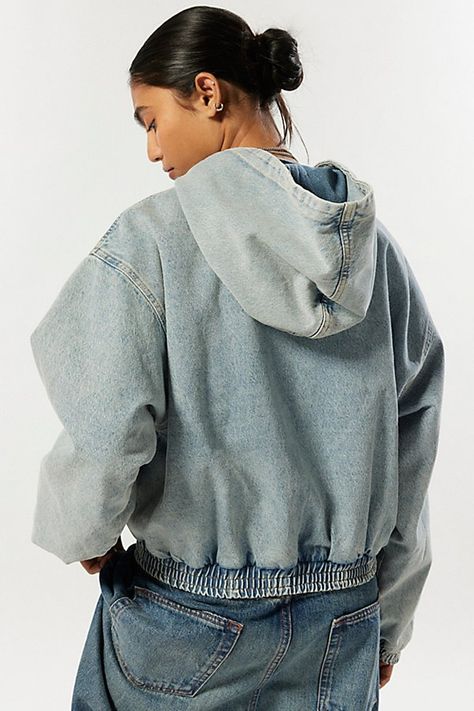 Updated BDG denim jacket in a hooded, zip-up style. Designed out of soft denim in an oversized, cropped fit with balloon sleeves, a classic hoodie and a cinched hem. Exclusively at Urban Outfitters. Features BDG Kelly denim zip up hoodie jacket Cropped denim jacket Crew neckline with hood and string details Balloon sleeves with cinched cuffs Full zip-up bodice Cinched hem Oversized baggy fit Cropped length Zip closure UO exclusive Content + Care 100% Cotton Machine wash Imported Size + Fit Model in Blue is 5’8" and wearing size Small Measurements taken from size Medium Length: 25" | BDG Kelly Zip-Up Hooded Denim Jacket in Blue, Women's at Urban Outfitters Hooded Denim Jacket, Denim Hoodie, Jeans Cargo, Cropped Denim Jacket, Blue Fits, Cropped Denim, Baggy Fits, Hoodie Jacket, Jeans For Sale