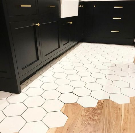 Get inspired with our FLOOR TRANSITION IDEAS. Our images will help get your creative juices flowing, helping you take your designs to the next level... #floortransitionideas #floortransitionideaswoodtotile #floortransitionideaslaminate #floortransitionwoodtotilekitchens #floortransitionideaswood #floortransitionideaswoodinspiration #tiletowoodtransition #tiletowoodfloortransition #tiletohardwoodtransition #tiletotiletransitionideas #tiletowoodtransitionkitchen #tiletowood White Hexagon Floor, Japanese Kitchen Ideas, Floor Transition Ideas, Waterproof Bathroom Flooring, Tile To Wood Transition, Black Cabinetry, Floor Transition, Transition Flooring, Transition Ideas