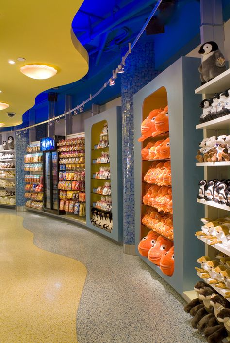 The Georgia Aquarium Gift Shop uses Juno Flex 12™ luminaires to highlight merchandise while blending effortlessly with the store's unique architectural details. Aquarium Shop Interior Design, Aquarium Gift Shop, Cool Stores, Toy Store Design, Gift Shop Interiors, Pet Store Design, Aquarium Store, Aquarium Shop, Kids Salon