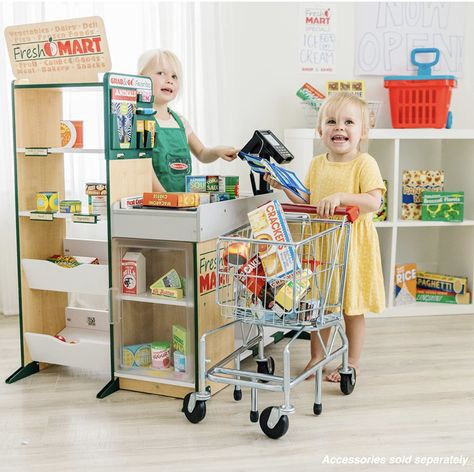 Free-standing sturdy wooden grocery store for playful shopping; 32” x 35.5” x 25” assembled
Includes hand-cranked conveyor belt, beeping “scanner,” bagging area, card swipe machine, and cash drawer
Shop on one side, ring up groceries on the other
Ample shelving on both sides for display and storage; smooth, curved corners and edges; styles and colors may vary
Makes a great gift for preschoolers, ages 3 to 6, for hands-on, screen-free play Grocery Wagon, Stock Shelves, Kids Play Store, Card Swiping, Toys Template, Toy Shopping Cart, Play Grocery Store, Playroom Decoration, Cash Drawer