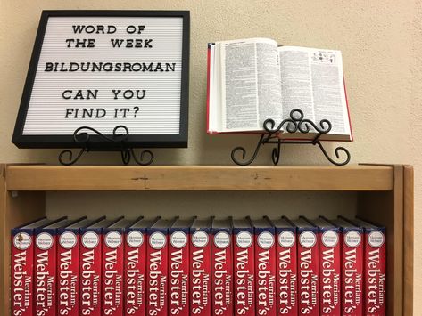 Word of the Week   I got this idea from the amazing Facebook GroupSchool Librarian's Workshop(Closed Group must request to join).  My students don't have a lot of browsing time in the library so I opened the dictionary up to the page with the word. I'm hoping it will help students build their vocabulary and at least see what the inside of a real dictionary looks like!  I put this on top of my class set of dictionaries.  I'll be posting my list of words used atRIYL Libraries.  You don't have to b Word Of The Week Display, Library Letter Board, Brooklyn Library, Middle School Bulletin Boards, Middle School Libraries, Dictionary Words, Library Book Displays, Elementary Library, School Librarian