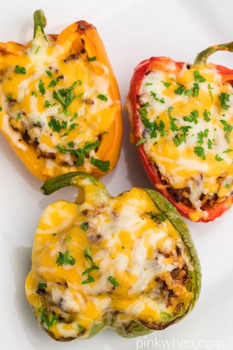 Air Fryer Stuffed Peppers are a delicious and easy appetizer or light lunch or dinner. Made with fresh bell peppers, lean ground beef, colby jack cheese, rice, seasonings, and topped with fresh parsley. You'll love the amazing blend of flavors and this quick and easy air fryer recipe.