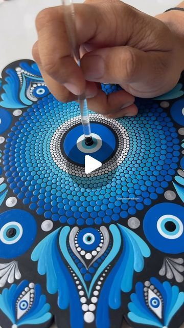 Vaishnavi | Mandala Artist on Instagram: "Embracing the power of the evil eye dot mandala. 🧿  This intricate design not only captivates with its beauty but also serves as a symbol of protection and good fortune. ✨  Each dot, each line, holds a deeper meaning, creating a shield against negativity. 🌟🧿   #mandalabyvaishnavi #mandala #dotmandala #evileyedotmandala #EvilEye #MandalaArt #evileyemandala #evileyeart #evileyemandalaart #trending #reelsinstagram #reels #trendingreels" Hamsa Art, Evil Eye Art, Symbol Of Protection, The Evil Eye, Deeper Meaning, Dot Mandala, Artist On Instagram, Good Fortune, Intricate Design