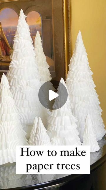 Lindsay Daniel on Instagram: "How to Make Paper Trees  Supplies needed: White poster board String Pencil Scissors White coffee filters White jumbo cupcake liners White regular cupcake liners (optional) Hot glue gun Hot glue sticks  1. Attach pencil to string. Hold string in place at one corner of the poster board, with pencil at the opposite corner. Draw an arc that is roughly a quarter circle.  2. Repeat with the remaining poster board with smaller arcs. I was able to get 2-3 cones out of one piece of poster board.   3. Cut out cone shapes.   4. Roll into cone and hot glue together. I thought this was the hardest step. It takes some patience. Trim the bottom of cone to make it even.  5. Repeat with smaller cones. I found these instructions and photos helpful (plus you can see an additiona How To Make A Cone Out Of Poster Board, Foam Cone Trees Christmas Diy, Paper Mache Cone Christmas Tree, How To Make Paper Cones, Coffee Filter Trees, Diy Cone Trees Christmas, How To Make A Paper Cone, How To Make A Cone Out Of Paper, Paper Cones Diy