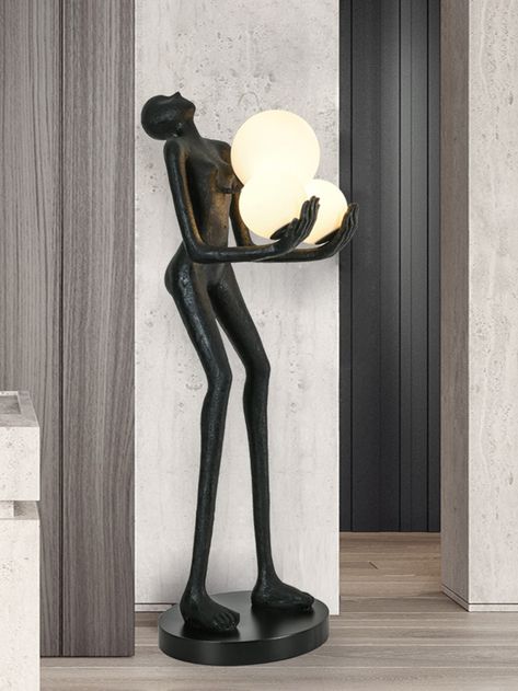 The Moonlit Guardian  Floor Lamp is inspired by the protective and nurturing spirit of a celestial guardian. The figure is elegantly designed to cradle glowing orbs, evoking a sense of warmth and security. The textured black finish gives it a timeless, artistic appeal, making it a perfect addition to bedrooms, living rooms, or cozy reading nooks. The Moonlit Guardian  Floor Lamp combines functionality with sculptural artistry, offering a soft, ambient light that enhances the atmosphere of any ro Celestial Guardian, Large Ceiling Fans, Ceiling Fans Without Lights, Recessed Wall Lights, Arc Lamp, Task Floor Lamp, Recessed Wall, Arm Floor Lamp, Cozy Reading Nook