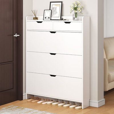 Keep your home tidy and organized, starting with your shoe cabinet. This shoe cabinet is beautifully designed to make it easy to organize and find your favorite shoes. Every pair of shoes holds stories and memories, making every time you wear them a great time. | Latitude Run® 18 Pair Shoe Storage Cabinet Manufactured Wood in Brown / White | 49.21 H x 39.37 W x 6.69 D in | Wayfair | Organization Shoes In Living Room Storage Ideas, Small Shoe Cabinet Entryway, Ikea Shoe Storage Cabinet, Shoe Storage Narrow, Shoe Storage Cabinet Entryway, Small Shoe Cabinet, Narrow Shoe Storage, Ikea Shoe Storage, White Shoe Rack