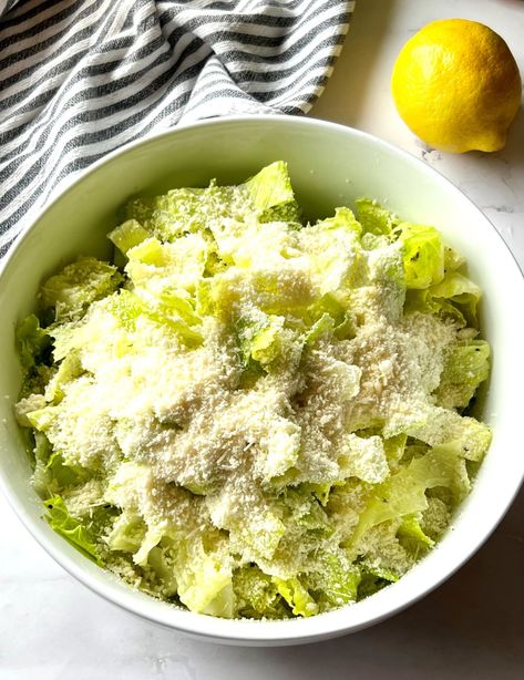 This simple 4-ingredient Nana's Crunchy Lemon Parmesan Salad will be a new favorite when you want something fresh and easy to make. Each bite is bursting with lemon flavor and salty parmesan cheese. Lettuce Parmesan Salad, Lemon And Onion Salad, Lemon Parm Salad, Crunchy Lemon Parmesan Salad Romaine, Lemon Onion Salad, Crunch Lemon Parmesan Salad, Parmesan Chopped Salad, Crunchy Lemon Parmesan Salad, Lemon Parmesan Salad