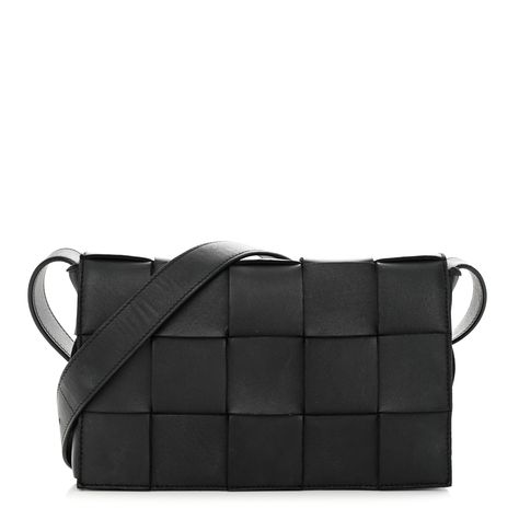 This is an authentic BOTTEGA VENETA Lambskin Maxi Intrecciato Cassette Crossbody Bag in Black. This stylish messenger bags crafted of woven intrecciato leather in black. The bag features an adjustable crossbody strap with silver hardware and a front flap. The flap opens to a leather interior with a zipper pocket. Bottega Veneta Cassette Bag, Bottega Veneta Cassette, Crossbody Bag Black, Bottega Veneta Intrecciato, Messenger Bags, Black Cross Body Bag, Leather Interior, Crossbody Strap, Bago