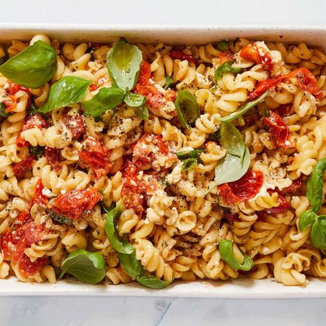 You won't believe these colorful pasta creations are real Pasta With Cherry Tomatoes, Tomatoes And Cheese, New York Times Cooking, Cherry Tomato Recipes, Cherry Tomato Pasta, Feta Pasta, Tomato And Cheese, Nyt Cooking, Cheese Pasta